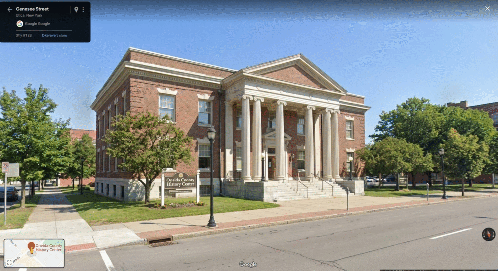 Exterior view of the Oneida County History Center Utica building on Genesee Street with white columns
